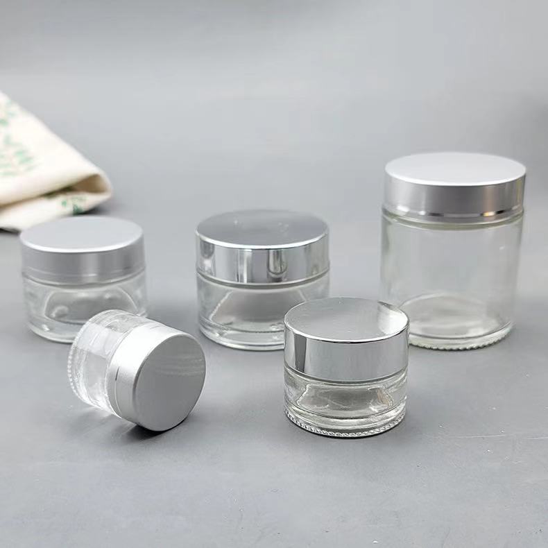 Cosmetic packaging 1oz 2oz 5g10g15g 30g 50g 100g glass cream cosmetic jar with Metallic plasticslid