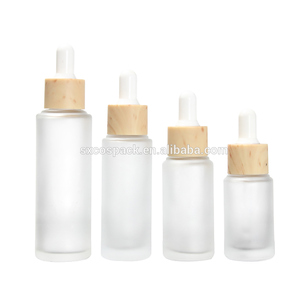 Cosmetic packaging 20ml 25ml 30ml 50ml matte clear essential oil dropper bottle with wooden cap