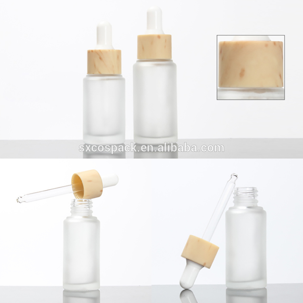 Cosmetic packaging 20ml 25ml 30ml 50ml matte clear essential oil dropper bottle with wooden cap