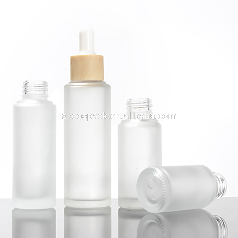 Cosmetic packaging 20ml 25ml 30ml 50ml matte clear essential oil dropper bottle with wooden cap