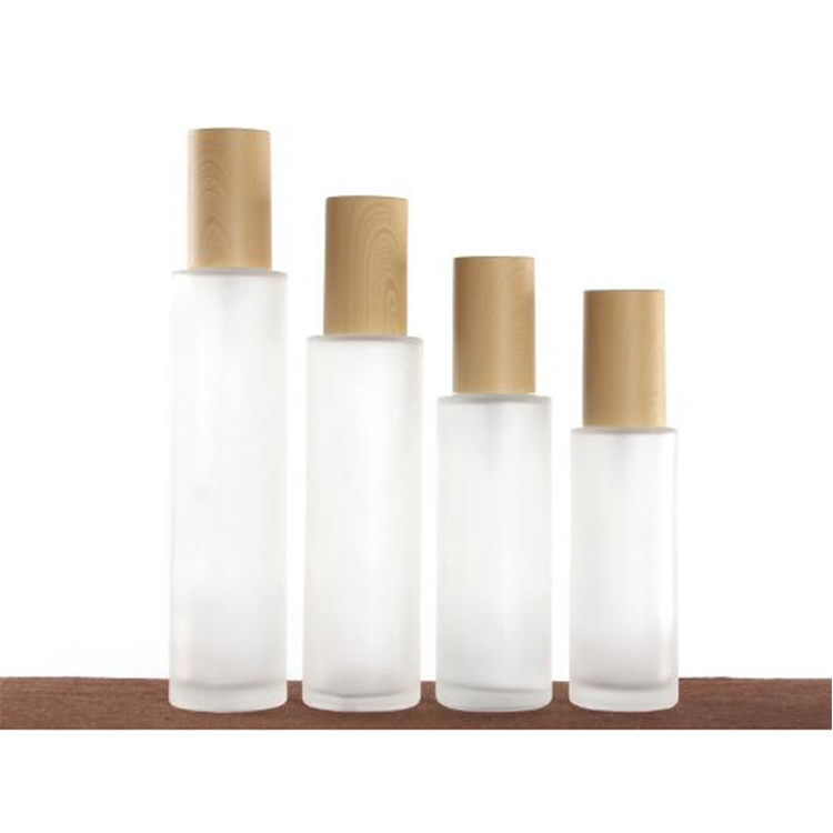 Cosmetic packaging 20ml 30ml 40ml 60ml 80ml 100ml 120ml frosted glass lotion oil perfume spray pump bottle with wood grain lid