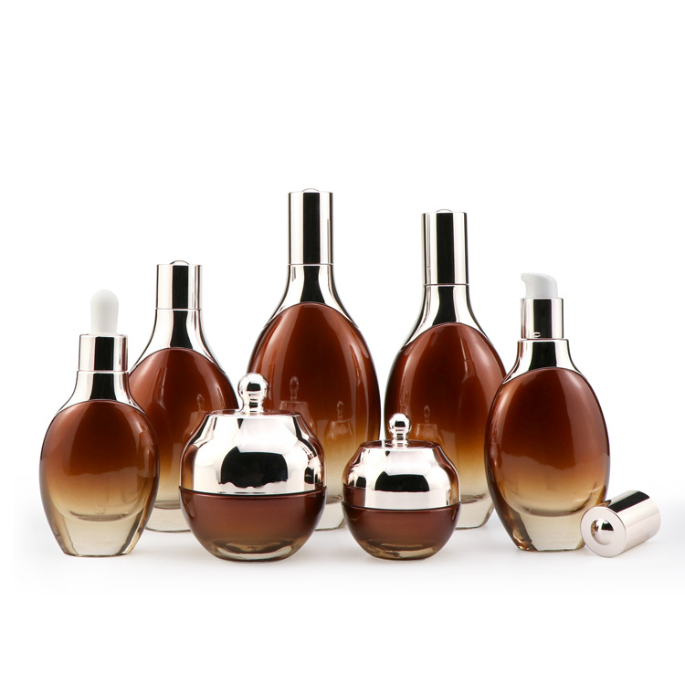 Cosmetic packaging 30ml 50ml 100ml 120ml glass essence lotion bottles full set custom amber glass bottle with rose gold pump