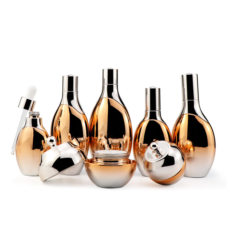 Cosmetic packaging 30ml 50ml 100ml 120ml glass essence lotion bottles full set custom amber glass bottle with rose gold pump