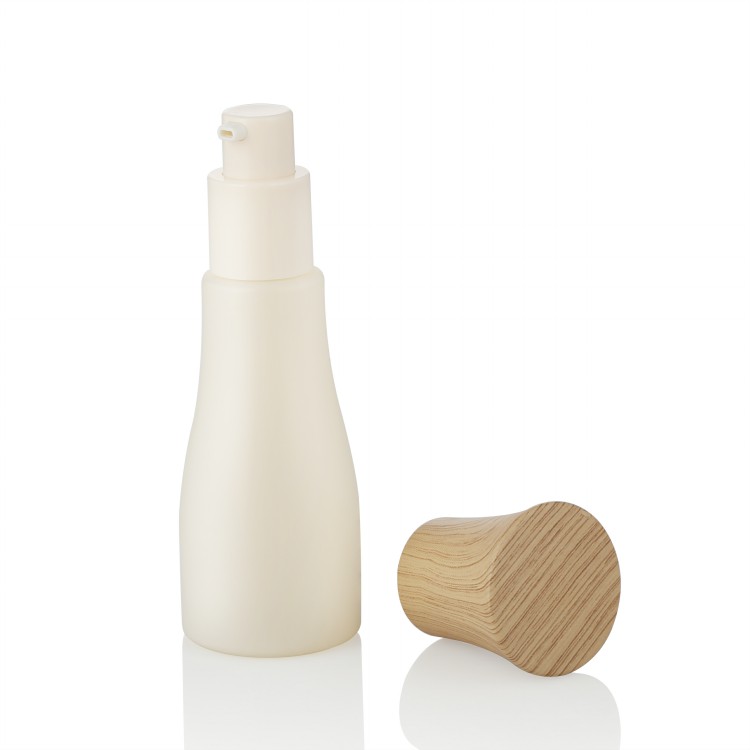Cosmetic packaging custom unique shape 50ml cosmetic glass bottle with bamboo cap and lotion pump