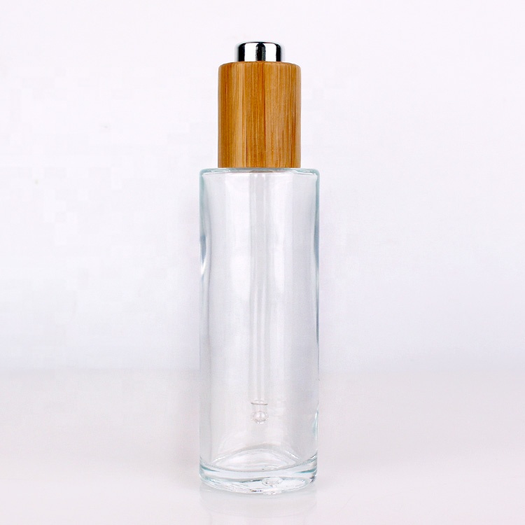 Cosmetic packaging cylinder essential oil bottle 75ml glass bottle with bamboo dropper