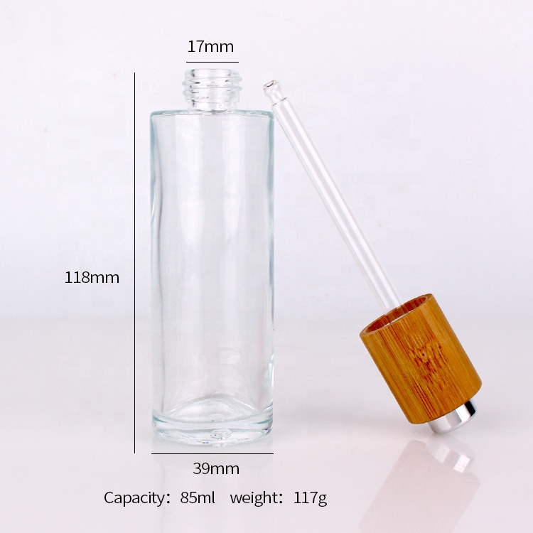 Cosmetic packaging cylinder essential oil bottle 75ml glass bottle with bamboo dropper