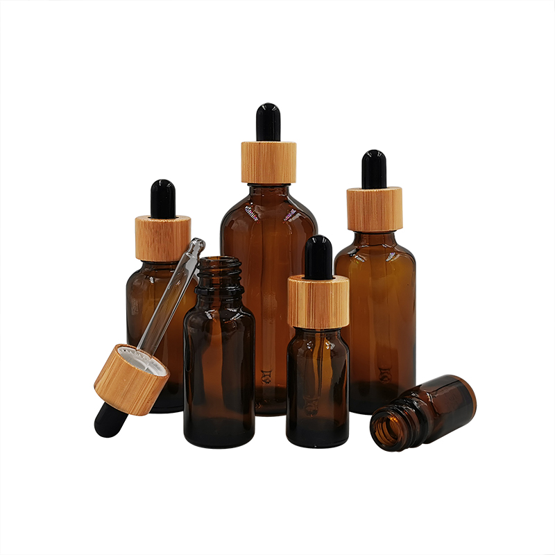 Cosmetic packaging design 10ml 15ml 30ml 50ml 100m 1oz empty amber black essential oil glass dropper bottles with bamboo lids