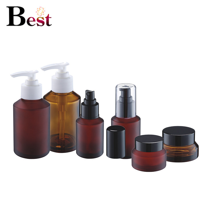 Cosmetic packaging painting 2oz frosted amber glass jars cosmetic glass bottle glass lotion bottle with black metal lid