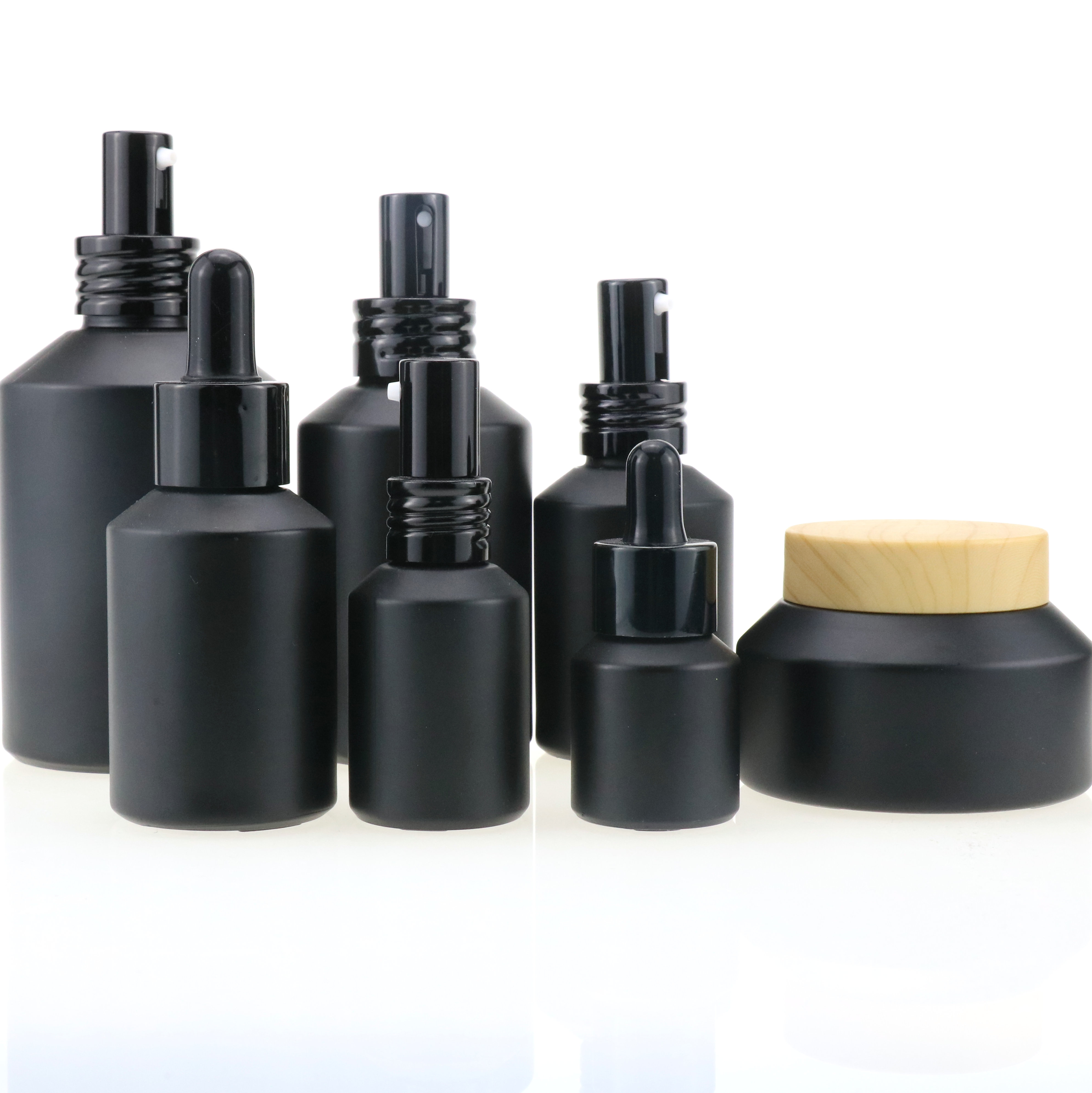 Cosmetic packaging slant shoulder matte black skin care set glass bottle cosmetic products with black dropper and jar with lid