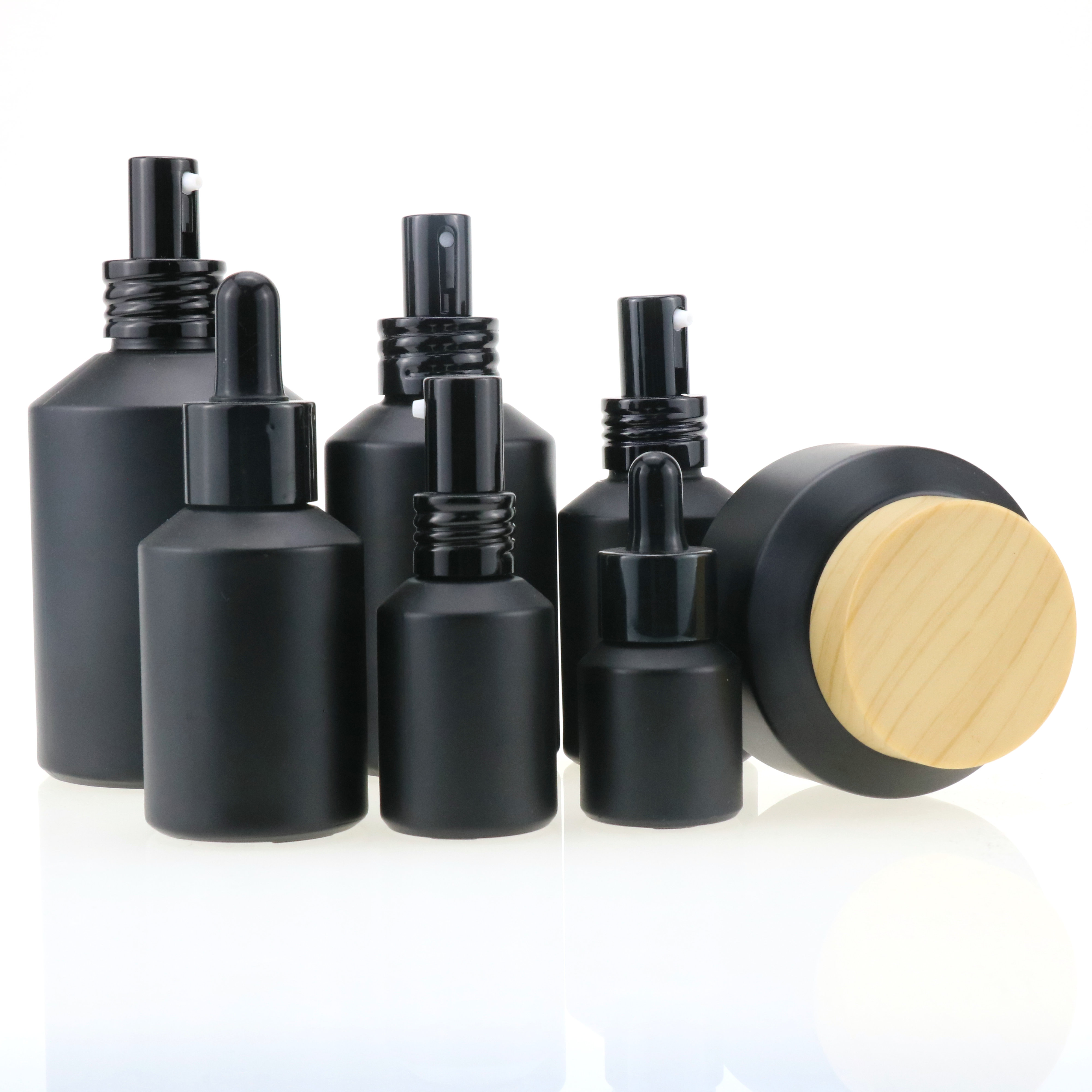 Cosmetic packaging slant shoulder matte black skin care set glass bottle cosmetic products with black dropper and jar with lid