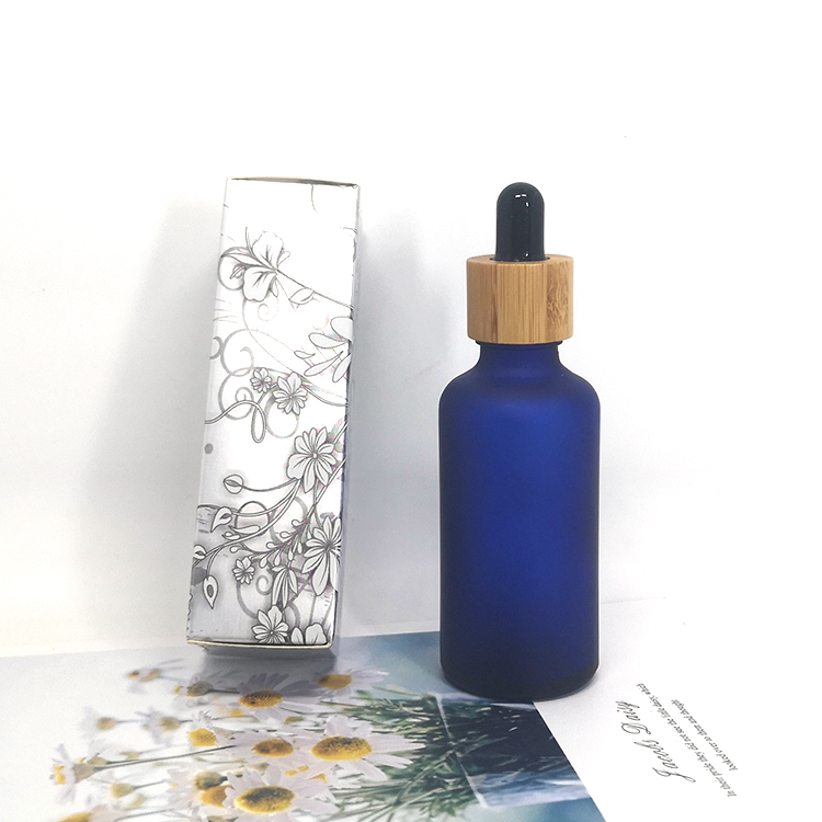 Cosmetic skin care oil packaging 30ml frosted cobalt blue glass bottles with bamboo dropper caps