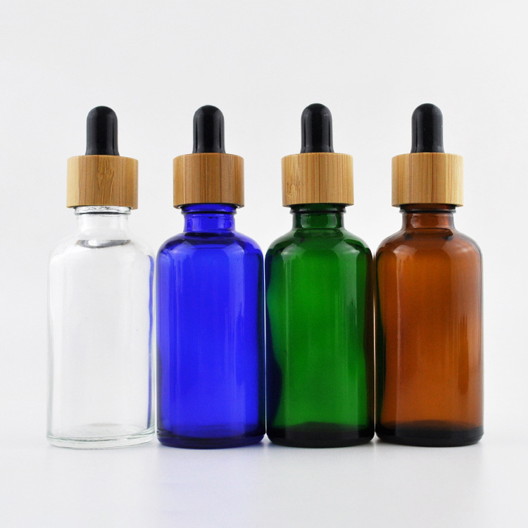 Cosmetic skin care oil packaging 30ml frosted cobalt blue glass bottles with bamboo dropper caps