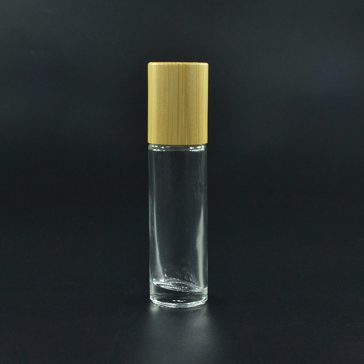 CosmeticFrosted clear black 10ml glass essential oil roller bottle with gold silver black bamboo lid stainless steel roller ball