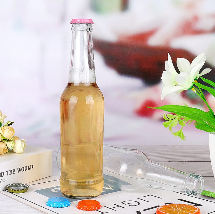 Custom 330ml Empty Transparent Glass Beer soda Juice Bottle with Crown Cap Factory Supplier