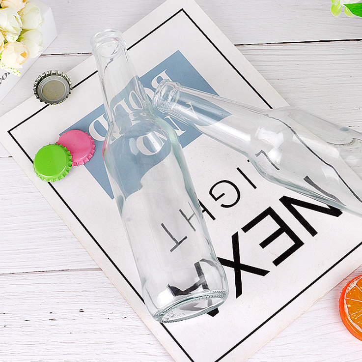 Custom 330ml Empty Transparent Glass Beer soda Juice Bottle with Crown Cap Factory Supplier