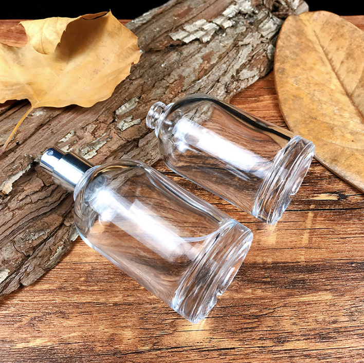 Custom Logo Luxury Mist Spray Transparent 50ml Round Glass Bottle Wholesale Empty Glass Perfume Bottle