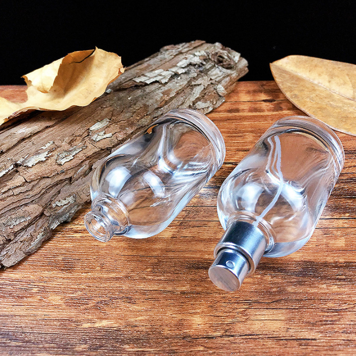 Custom Logo Luxury Mist Spray Transparent 50ml Round Glass Bottle Wholesale Empty Glass Perfume Bottle