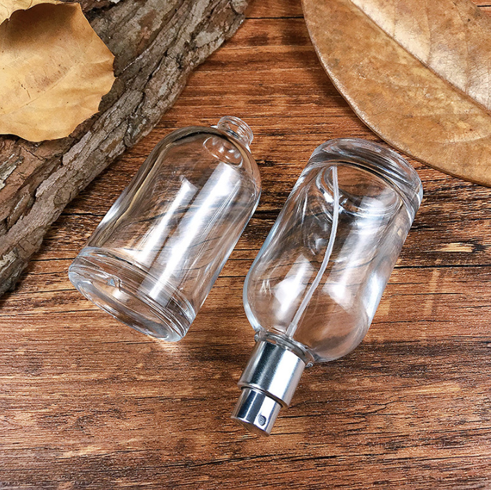 Custom Logo Luxury Mist Spray Transparent 50ml Round Glass Bottle Wholesale Empty Glass Perfume Bottle