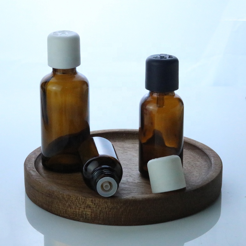 Custom child proof glass bottle 15ml 20ml 30ml 50ml 100ml Amber essential oil bottle with child-proof cap (GRA17)