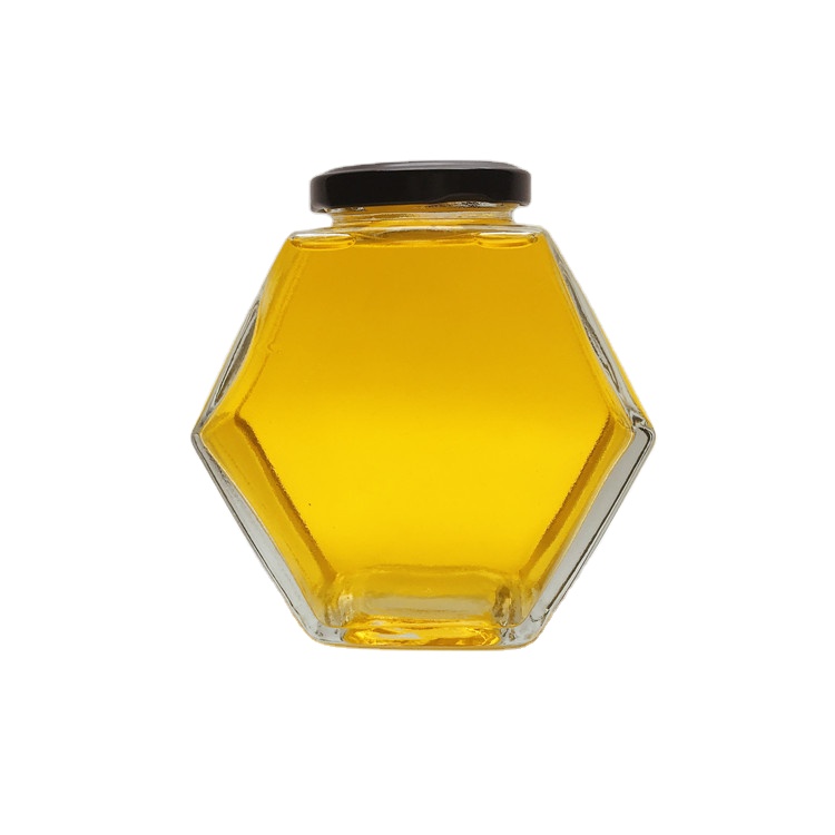 Custom design 380ml hexagonal shape empty honey glass bottle jar with black metal cap