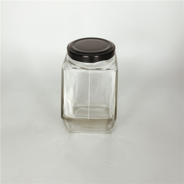 Custom design 380ml hexagonal shape empty honey glass bottle jar with black metal cap