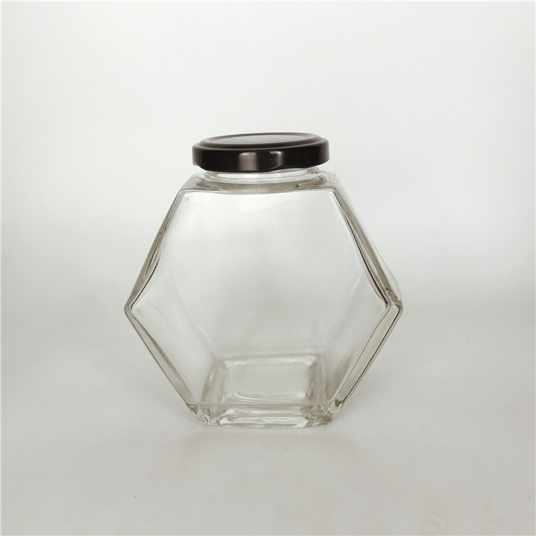Custom design 380ml hexagonal shape empty honey glass bottle jar with black metal cap
