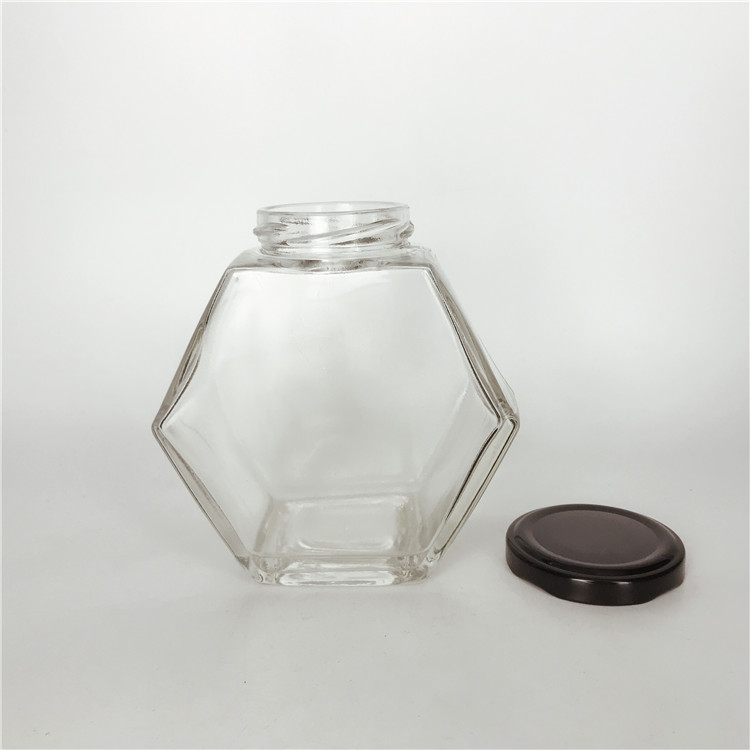 Custom design 380ml hexagonal shape empty honey glass bottle jar with black metal cap