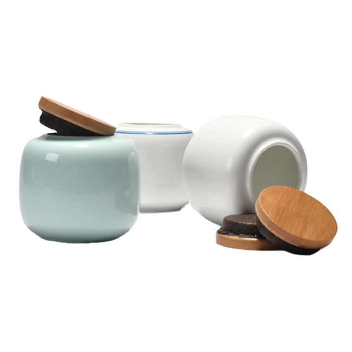 Custom design ceramic small tea canister with bamboo lid