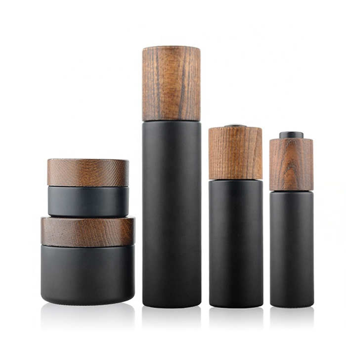 Custom empty 30ml 50ml 100ml matte black wooden lids cosmetic cream glass jar