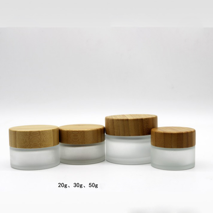 Custom frosted clear Cosmetic Cream Glass skin care  jar container and packaging With screw engraved logo bamboo lid