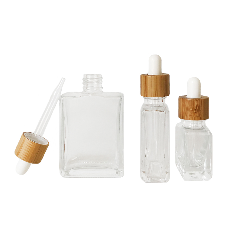 Custom glass bottle 15ml 30ml 50ml clear rectangle essential oil bottle glass dropper bottle with bamboo cap