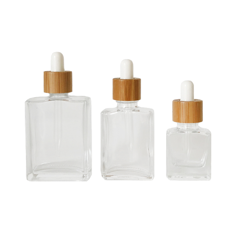 Custom glass bottle 15ml 30ml 50ml clear rectangle essential oil bottle glass dropper bottle with bamboo cap
