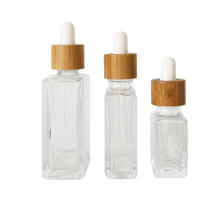 Custom glass bottle 15ml 30ml 50ml clear rectangle essential oil bottle glass dropper bottle with bamboo cap