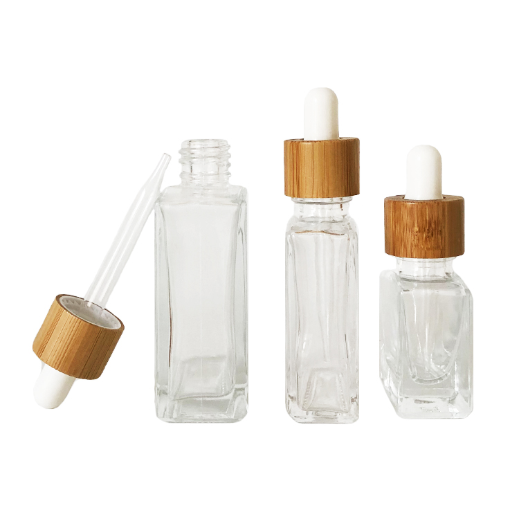 Custom glass bottle 15ml 30ml 50ml clear rectangle essential oil bottle glass dropper bottle with bamboo cap