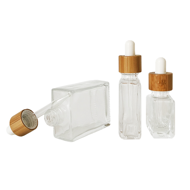 Custom glass bottle 15ml 30ml 50ml clear rectangle essential oil bottle glass dropper bottle with bamboo cap