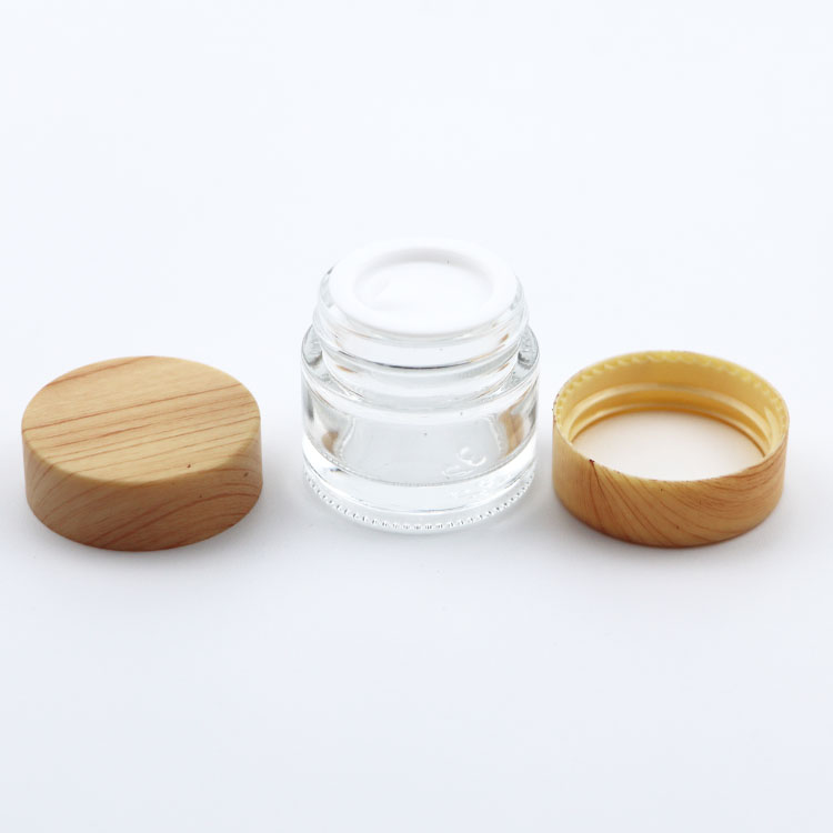 Custom glass jar 15ml 20ml 30ml 50ml 100ml clear glass cosmetic cream jar with wooden grain lid