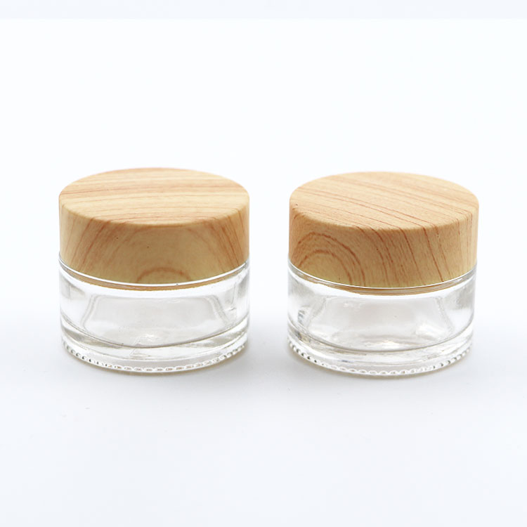 Custom glass jar 15ml 20ml 30ml 50ml 100ml clear glass cosmetic cream jar with wooden grain lid