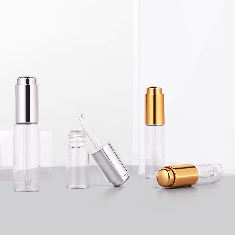 Custom logo 10ml 15ml 20ml glass dropper bottle with gold and silver press dropper cosmetic package container in good price