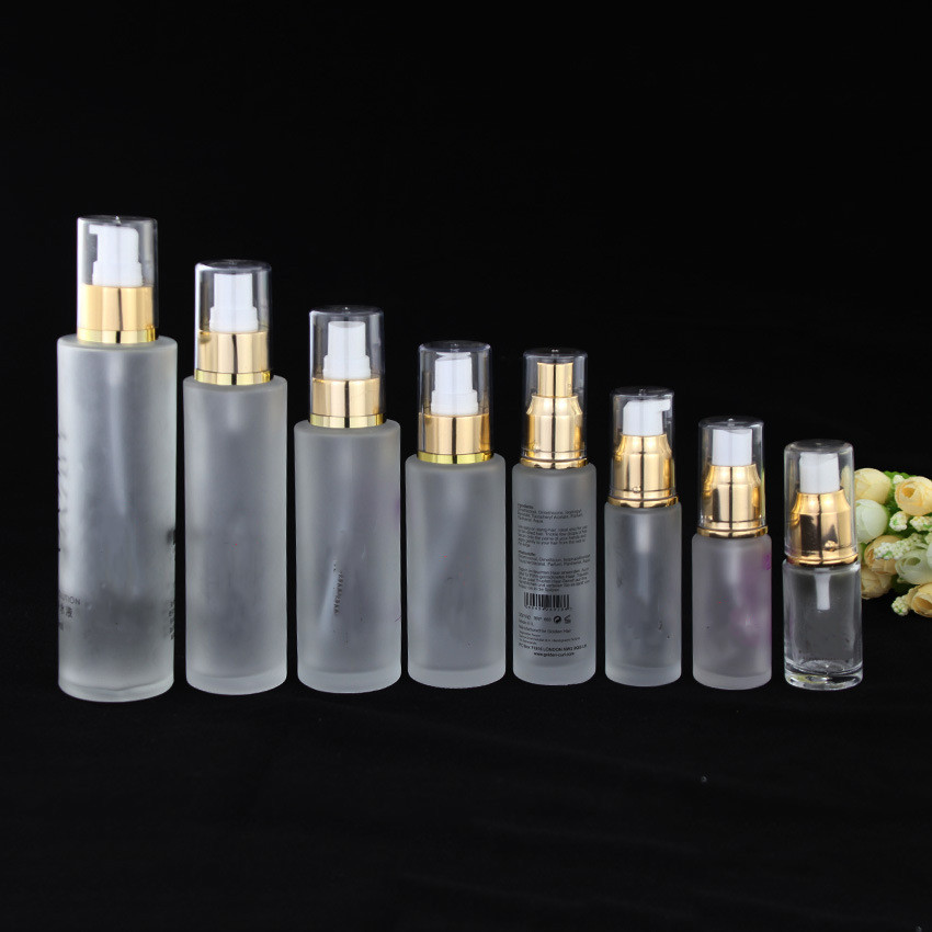 Custom logo 15ml 20ml 25ml 30ml 80ml 100ml 120ml 150ml glass lotion bottle and spray bottle with transparent cap gold line on it