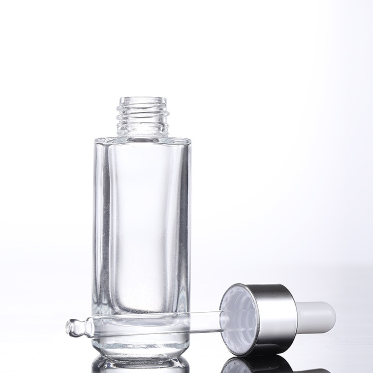 Custom logo 15ml 30ml 50ml clear square dropper bottle with gold and silver personal care production cosmetic package container