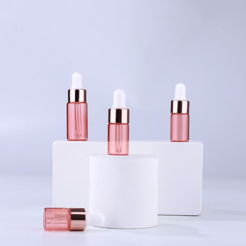 Custom logo 1ml 2ml 3ml 5ml golg rose glass dropper bottle with gold rose cap cosmetic package container in good price