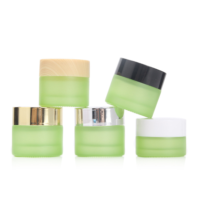 Custom logo 5g and 10g green and pearl white glass jar cosmetic package container with black white wood grain cap in good price