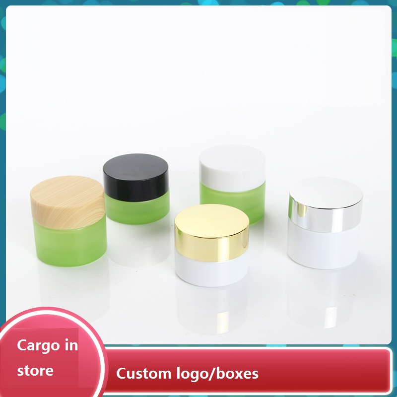 Custom logo 5g and 10g green and pearl white glass jar cosmetic package container with black white wood grain cap in good price