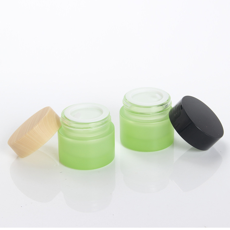 Custom logo 5g and 10g green and pearl white glass jar cosmetic package container with black white wood grain cap in good price