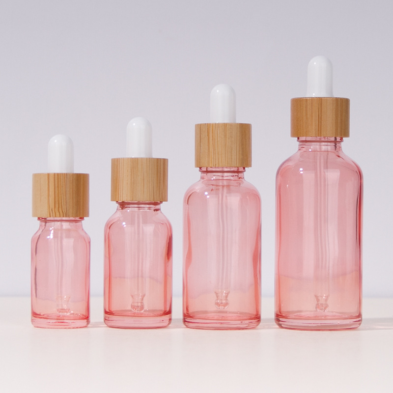 Custom logo 5ml 10ml 15ml 20ml 30ml 50ml 100ml pink glass bottle with rose pink dropper cosmetic package container in good price