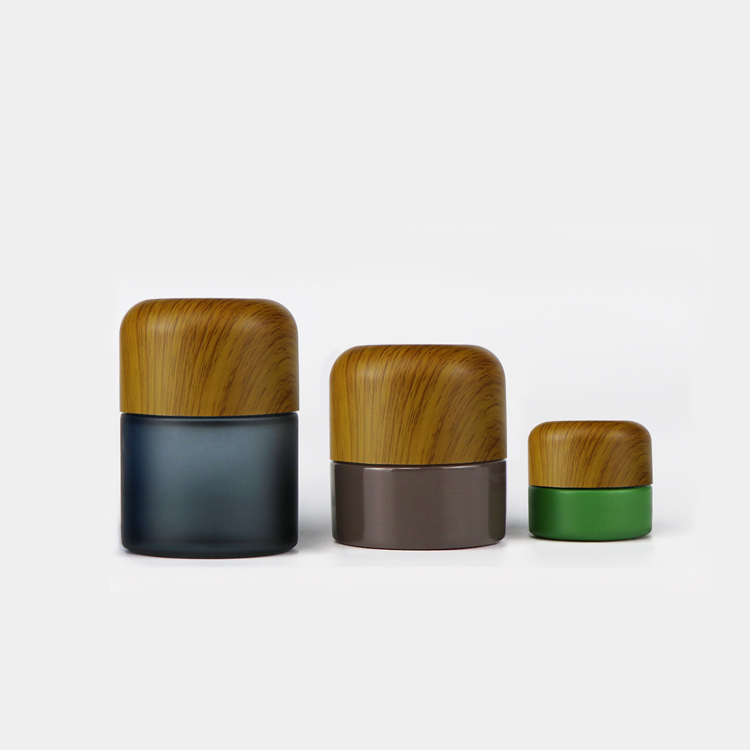 Custom logo 5ml 50ml 70ml 110ml matte black child resistant smell proof flower stash glass jars with wood dome lid