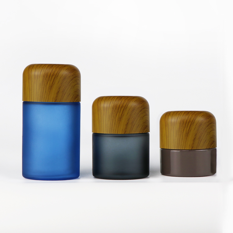 Custom logo 5ml 50ml 70ml 110ml matte black child resistant smell proof flower stash glass jars with wood dome lid