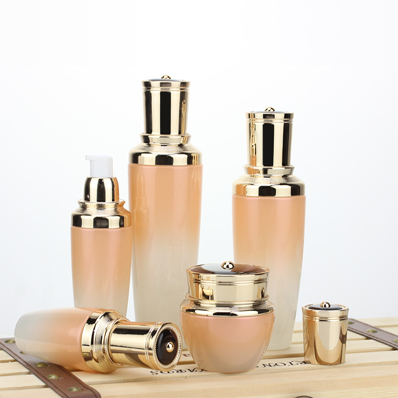 Custom logo Gradient orange Golden Crown Cosmetic Glass Bottle and jar with pearl luster cosmetic package for personal care