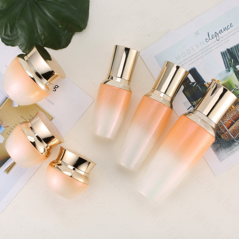 Custom logo Gradient orange Golden Crown Cosmetic Glass Bottle and jar with pearl luster cosmetic package for personal care
