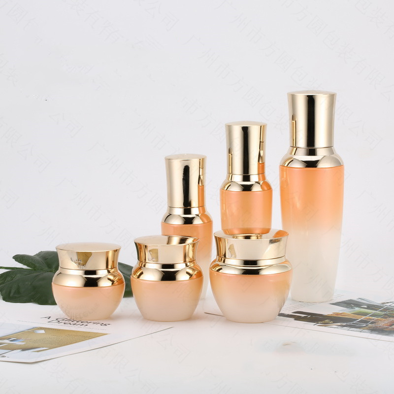 Custom logo Gradient orange Golden Crown Cosmetic Glass Bottle and jar with pearl luster cosmetic package for personal care